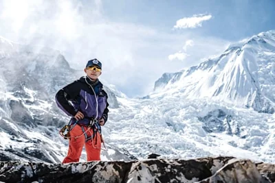 LOOK: taken on 28 March 2024, and released by 14 Peaks Expedition shows Nepali mountaineer Nima Rinji Sherpa at the Mount Annapurna base camp. At just 18 years old, Nepali mountaineer Nima Rinji Sherpa is on the brink of a remarkable achievement. With 13 of the world's highest peaks already behind him, he is now just one summit away from becoming the youngest person ever to conquer all 14 mountains towering above 8,000 meters (26,247 feet). His final challenge, Shishapangma in Tibet, awaits him next month -- if China issues a permit. | Photo courtesy of 14 Peaks Expedition / AFP