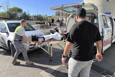 Civil Defense first-responders carry a wounded man whose handheld pager exploded at al-Zahraa hospital in Beirut, Lebanon, Tuesday, Sept. 17, 2024.