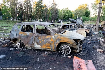 A car pictured charred and ruined after a Russian strike on Vilniansk