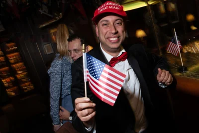 A Trump supporter celebrates during an election night watch party at The Stafford in London on Wednesday morning.