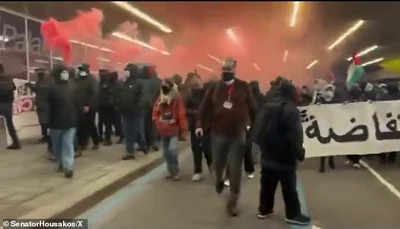 At one point protesters managed to release red smoke bombs into the crowd.