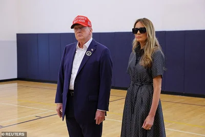 Republican presidential nominee and former U.S. President Donald Trump, accompanied by former U.S. first lady Melania Trump, speaks to reporters after voting at Mandel Recreation Center on Election Day in Palm Beach, Florida