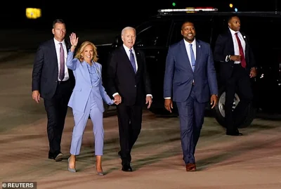 U.S. President Joe Biden and First Lady Jill Biden walk after deboarding their airplane at Raleigh-Durham International Airport in Raleigh, North Carolina, U.S., after participating in a presidential debate in Atlanta, Georgia, U.S., June 28, 2024