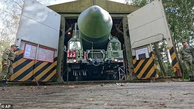 A Russian Yars strategic ballistic missiles launcher moves out a hangar during a drills in Novosibirsk region, Russia