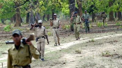 FILE - Indian paramilitary soldiers patrol area having a presence of Naxalites, at Dantewada district, Chattisgarh, India, Tuesday, April 17, 2007.