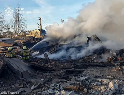 Firefighters work at the site of residential area hit by a Russian missile strike, amid Russia's attack on Ukraine, in Lviv region, Ukraine November 17, 2024