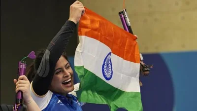 Manu Bhaker celebrates with the Indian flag after winning the bronze medal on Sunday. (AP)
