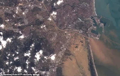 AFTER: Satellite image shows severe flooding in Valencia on October 30 after heavy rains