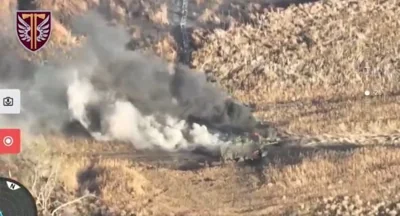 Smoke billowing from a Russian armoured vehicle