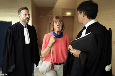 Gisele Pelicot (C), escorted by her lawyers Stephane Babonneau (R) and Antoine Camus (L), exits the criminal court in Avignon, southern France, 16 September