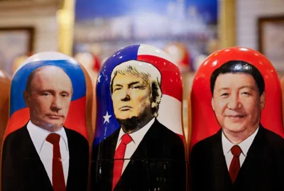 Traditional Russian Matryoshka wooden dolls, also known as nesting dolls, depicting U.S. Republican presidential candidate Donald J. Trump, center, Russian President Vladimir Putin, left, and Chinese President Xi Jinping  are on display at a gift shop in Moscow, Russia, Nov. 6. EPA-Yonhap