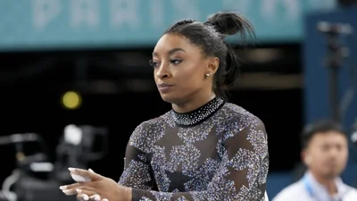 Simone Biles says she has calf issue during Olympic gymnastics qualifying but keeps competing for U.S.