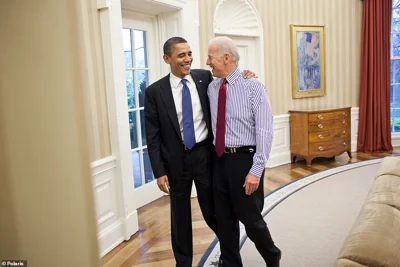 President Barack Obama hugs Biden in the Oval Office after a budget meeting on April 8, 2011. Obama said he picked his former rival in the 2008 election because he 'has moral conviction and clarity.' Becoming vice president is arguably what set Biden up to run for president and win in 2020