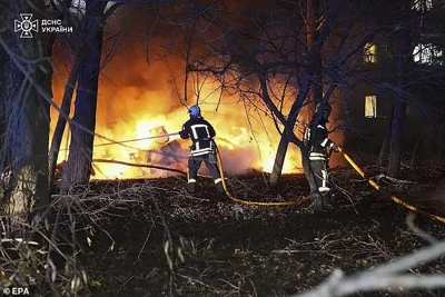 Firefighters were seen battling the flames resulting from the strike at the nine-storey building in Sumy on November 17