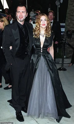 The two worked closely throughout the Queen of Pop's career, but had a falling out when he published a bombshell book about her (Pictured at the Vanity Fair Oscar Party in 1998)