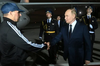 Russian hitman Vadim Krasikov is greeted by President Vladimir Putin, his de facto boss, after landing in Moscow