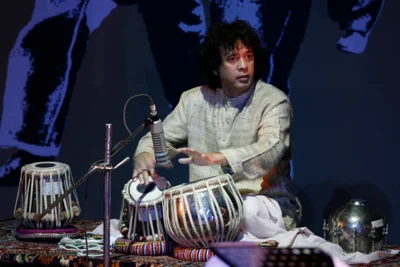 Indian drum maestro Zakir Hussain performs at the ‘Living Dream Concert’ in New Delhi on 16 February 2009