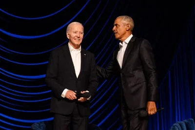President Biden and former President Barack Obama on a stage together. 