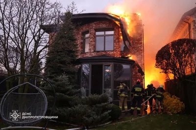 Firefighters work at the site of a missile attack by Russia in Dnipro, Ukraine