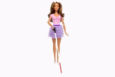 The first blind Barbie (pictured here) has a white and red walking stick and silver sunglasses