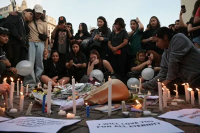 ‘THE DAY THE MUSIC DIED’ Fans light candles as they pay tribute to the late British singer Liam Payne at the Obelisco in Buenos Aires on Oct. 17, 2024. Tributes poured in  for British singer Liam Payne, a former member of the best-selling boy band One Direction, after he plunged to his death from the balcony of a Buenos Aires hotel on October 16. PHOTO BY JUAN MABROMATA / AFP