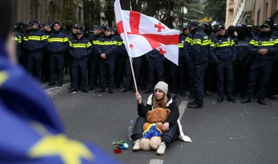 Opposition protesters rally outside Georgia’s parliament