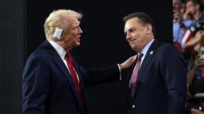 Former President Donald Trump greets Rep. Richard Hudson (R-NC), Chair of the National Republican Congressional Committee (NRCC), on the fourth day of the Republican National Convention at the Fiserv Forum on July 18, 2024, in Milwaukee, Wisconsin.