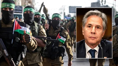 Antony Blinken imposed over an image of Hamas fighters