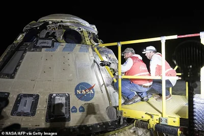 Boeing and NASA teams working around NASA's Boeing Crew Flight Test Starliner spacecraft after it landed at White Sands, New Mexico, on Saturday