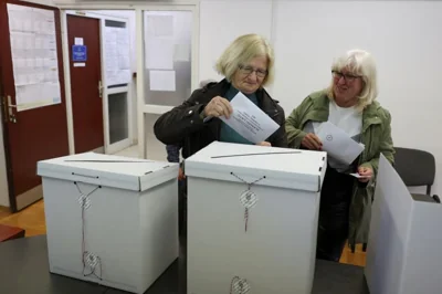 Women vote in the parliamentary election at a polling station in Zagreb