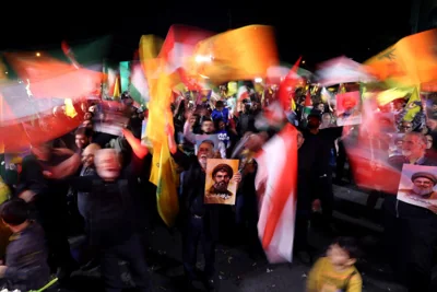 Iranians celebrate holding flags