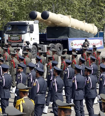 Iran has hinted it could build a nuclear weapon if Benjamin Netanyahu strikes Tehran's atomic sites - and target Israel's own nuclear facilities in response. Pictured: A S-300 missile system is displayed during the annual Army Day celebration at a military base in Tehran, April 17 2024