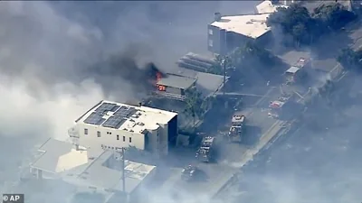 At least one mansion was seen burning as firefighters fought hard to keep it from spreading to nearby homes along the coastline of Malibu on Wednesday