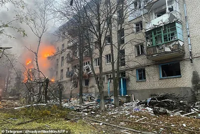 A burning residential building following a missile attack in Mykolaivka, Donetsk region, today