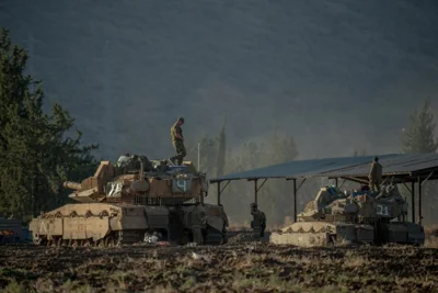 Israeli tanks and APC's gathered at the border