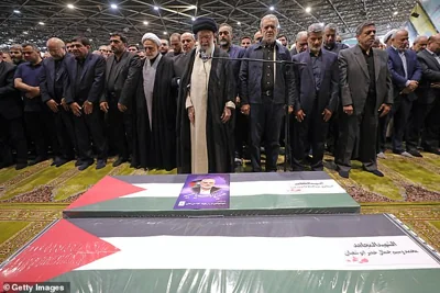 Iran's Supreme Leader Ayatollah Ali Khamenei leads a prayer over the coffins of Hamas leader Ismail Haniyeh and his bodyguard who were killed in an assassination blamed on Israel