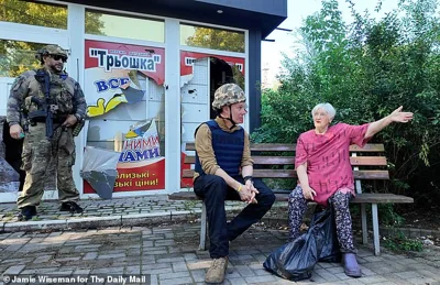 Daily Mail journalist Richard Pendlebury and guide Lieutenant Oleh in the Ukrainian town of New York