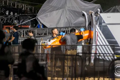 Forensic personnel move a body after a stage collapsed during a campaign rally for Mexican presidential candidate Jorge Alvarez Maynez in San Pedro Garza Garcia, Nuevo Leon, Mexico, on May 22, 2024. A stage collapsed in northern Mexico as strong winds gusted through a presidential candidate's campaign rally, leaving at least five people dead and around 50 others injured, authorities said. AFP PHOTO