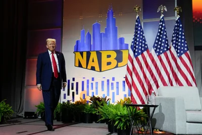 Donald Trump arrives at a National Association of Black Journalists conference in Chicago on July 31.