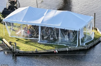 The wedding and the reception were held along the public harbor, with countless tables set up under massive white tents on the grass