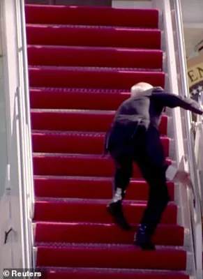President Joe Biden falling up the stairs of Air Force One in March 2021