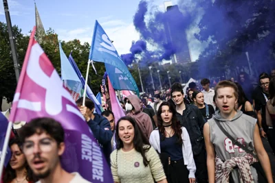 People take part in a protest in Nantes