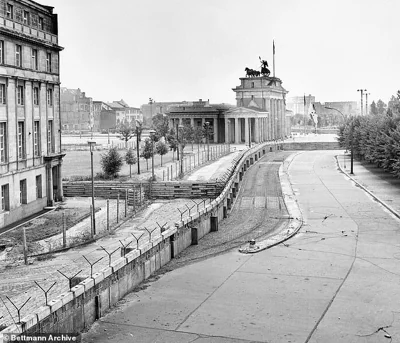 The Berlin Wall close to the Brandenburg Gate shortly after its construction.  The decision comes nearly 35 years after the fall of Berlin Wall and according to historians is the first time a former member of the East German secret police has been convicted for a homicide committed while on duty