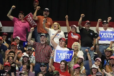 The Trump campaign has been defining Harris as a left-wing extremist who they say is out of touch with the swing-state voters. Trump supporters are seen here at a rally in Montana on Friday