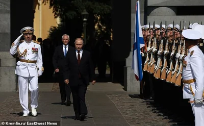 A suspected assassination plot against Vladimir Putin by Ukraine was halted after Russia 's defence minister called his opposite number at the Pentagon , according to Moscow. Pictured: Russia's President Vladimir Putin, Defence Minister Andrei Belousov at 28 July 2024 annual Navy Day parade in St Petersburg, Russia