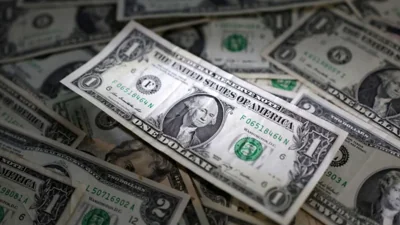 Dollar dips with Treasury yields after Bessent pick