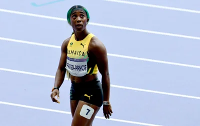 Shelly-Ann Fraser-Pryce of Jamaica looks at the score after competing in the Women’s 100m Round 1 heats